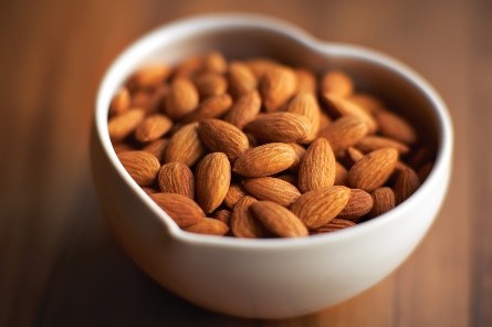 heart shaped bowl of almonds